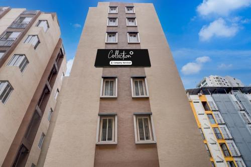 a tall building with a sign on it at Super Collection O Blue Ridge Hinjewadi in Hinjewadi