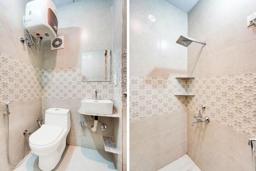 a bathroom with a toilet and a sink and a shower at Super Collection O Surajpur Chowk Greater Noida in Noida