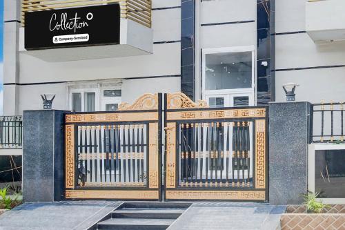a gate with benches in front of a building at Super Collection O Phagwara Near LPU Law Gate in Phagwāra