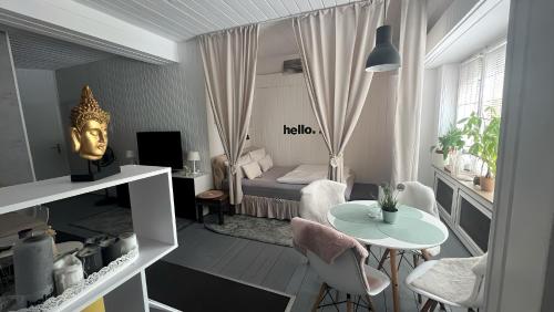 a small room with a bed and a table and chairs at Daheim in Essen in Essen