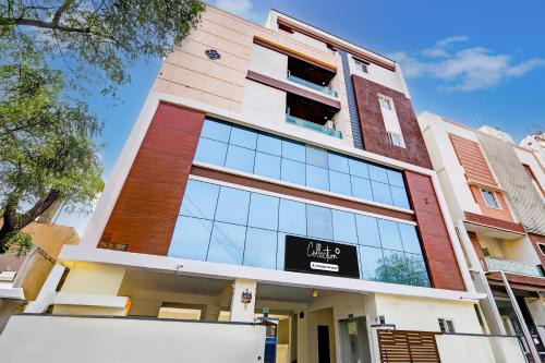 a building with a van parked in front of it at Super Collection O Vanasthalipuram in Hyderabad