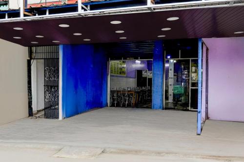 an empty building with blue and purple walls at Super Hotel O Janappanchatram in Chennai