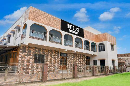 a building with a sign that reads mulico at Hotel O Durgapur Near NSHM College Formerly MON Palace in Mālandighi