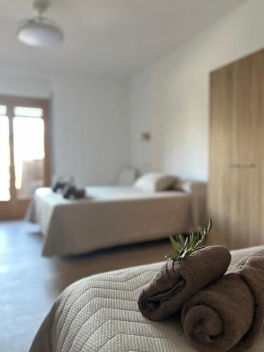 a hotel room with two towels on a bed at Can Sablet in Horta de San Joan