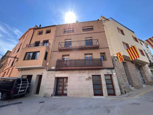 a building with the sun on top of it at Can Sablet in Horta de San Joan