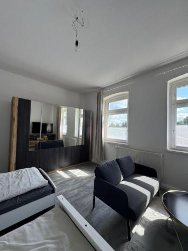 a living room with a couch and a bed at Seibel's SUITES - Big in Essen - Family & Group in Essen