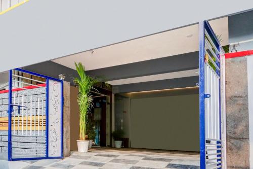 an entrance to a building with blue doors at Super Townhouse Rajahmundry in Rājahmundry