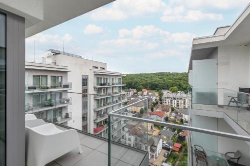 a balcony with a view of a city at Balticus by Solarento in Międzyzdroje