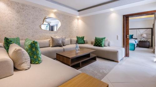 a living room with a couch and a table at Hotel Prestige Agadir Boutique & SPA in Agadir