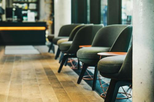 a row of chairs lined up in a room at Fritz Lauterbad in Freudenstadt