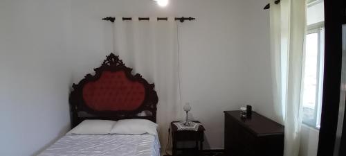 Ένα ή περισσότερα κρεβάτια σε δωμάτιο στο Vitorio's Guesthouse