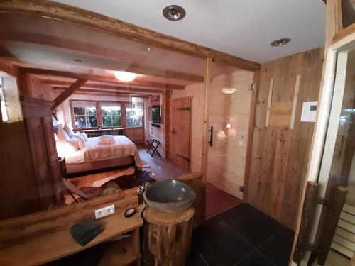 a room with a bedroom and a bed and a tub at Superior Suite Bergparadies Sauna - barrierfree in Inzell