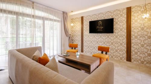 a living room with a couch and a table at Hotel Prestige Agadir Boutique & SPA in Agadir