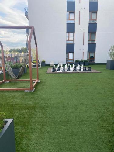 a lawn with a chessetts sidx sidx sidx sidx sidx sidx sidx sidx at Two bedroom LUXURIOUS Spacios Apartment in Vilnius
