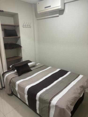 a bedroom with a large bed in a room at Condominio Irala in Santa Cruz de la Sierra