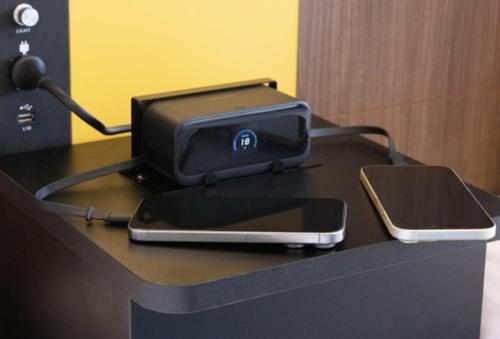 a table with a ipod and a cell phone on it at Henn na Hotel Maihama Tokyo Bay in Urayasu