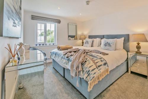 a bedroom with a large bed and a window at 1 Bed in Clyst Honiton oc-c32989 