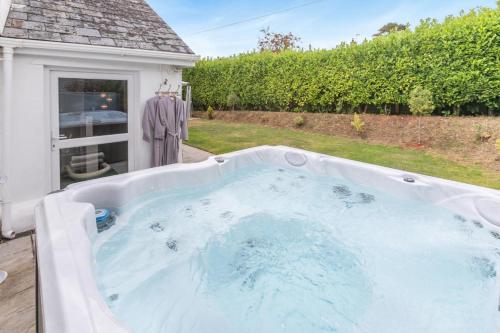 a hot tub in the backyard of a house at 1 Bed in Clyst Honiton oc-c32989 