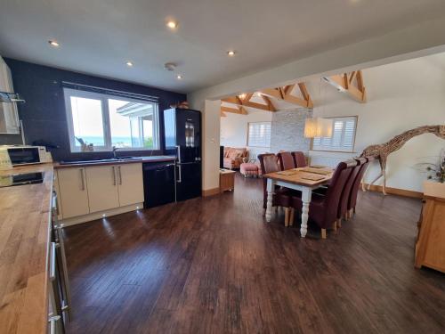 a kitchen and living room with a table and chairs at 3 Bed in Newlyn oc-s33015 in Newlyn