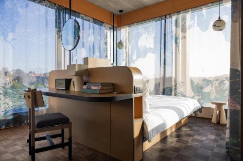 a bedroom with a bed and a large window at Mix Brussels --Gym & Wellness for adults only-- in Brussels