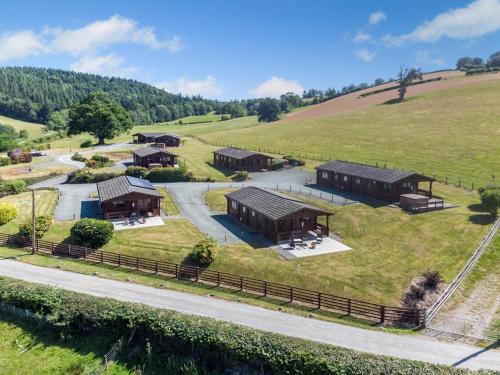 an aerial view of a farm with buildings on a hill at 1 Bed in Llandinam oc-t33065 in Llandinam