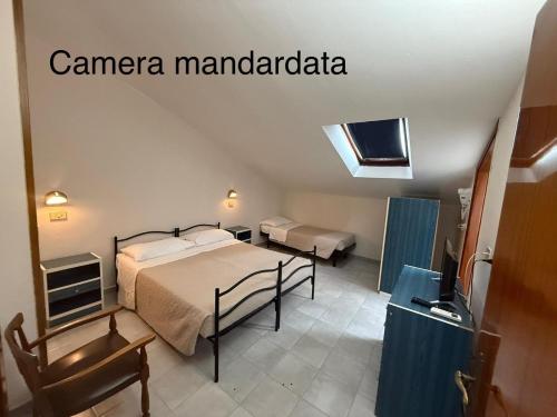 a bedroom with a bed and a tv in a room at Hotel Anny in Cervia