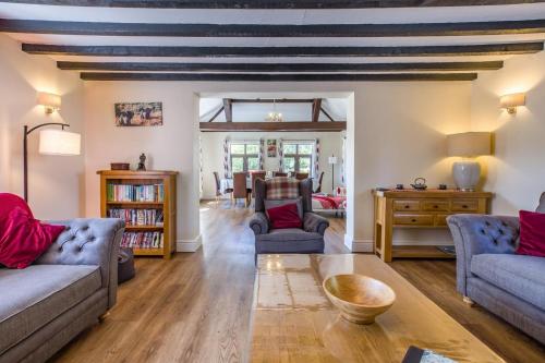 a living room with two couches and a table at 5 Bed in Clows Top oc-m32976 in Bayton