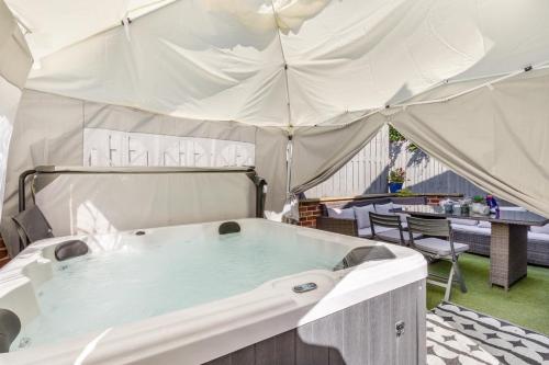 a tub in a tent with a table and chairs at 5 Bed in Blofield oc-s33037 in Blofield