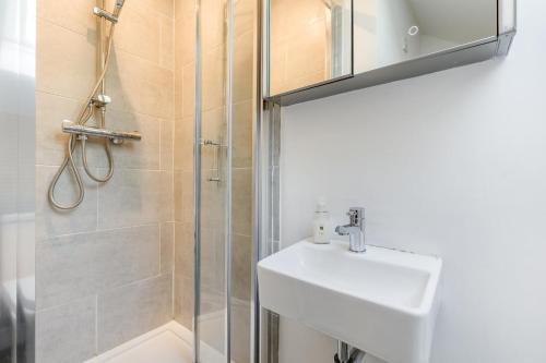 a bathroom with a sink and a shower at 5 Bed in Blofield oc-s33037 in Blofield