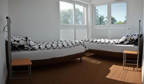 Katil atau katil-katil dalam bilik di Apartamenty Dario