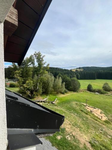 a view of a field from the porch of a house at Penzion Na Bělisku in Březiny