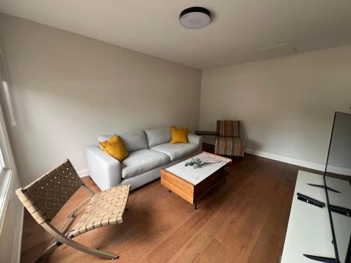 a living room with a couch and a coffee table at Adrian's Suites 2 Bedroom Familysuite in Wasaga Beach