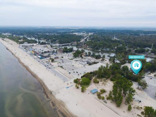 an aerial view of a beach with a sign at Adrian's Suites 2 Bedroom Familysuite in Wasaga Beach