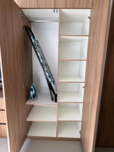 a closet with a surfboard in it at Monoambiente de Lujo en la Chura TARIJA! in Tarija