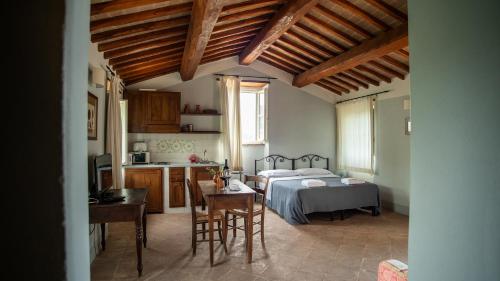 Ένα ή περισσότερα κρεβάτια σε δωμάτιο στο Casale Merlino
