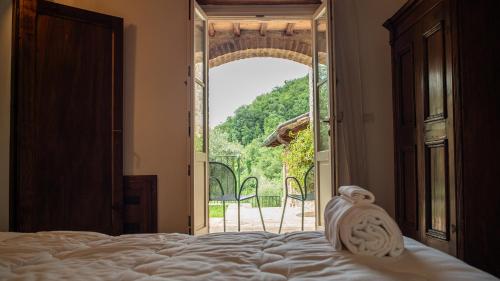 Ένα ή περισσότερα κρεβάτια σε δωμάτιο στο Casale Merlino