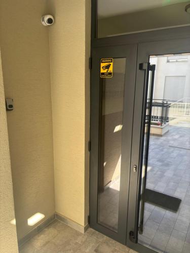 a door to a building with a sign on it at Valmere Members Luxury Sea View Apartment Tivat in Tivat