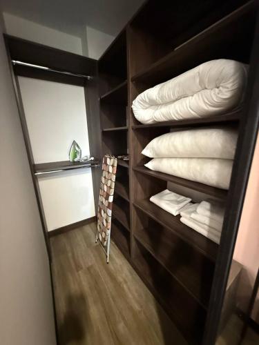 a room with a closet with pillows and towels at Апартаменти ВІП вул Під Голоском 15 б 9-1 in Lviv