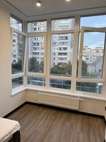 a large room with large windows in a building at Апартаменти ВІП вул Під Голоском 15 б 9-1 in Lviv