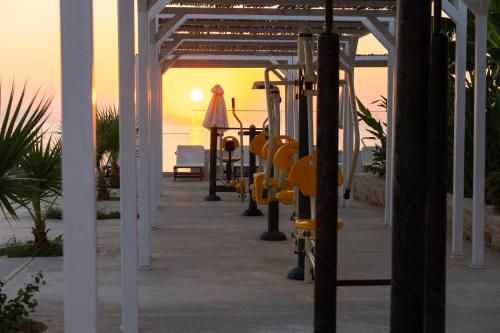 a row of exercise equipment on a patio at Rethymno Mare & Water Park in Rethymno Town