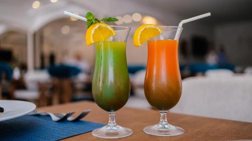 two drinks sitting on top of a table at Hotel Prestige Agadir Boutique & SPA in Agadir