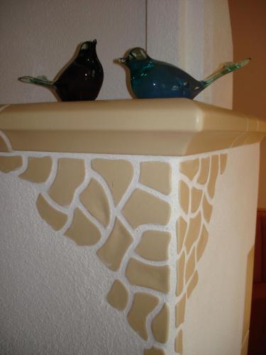 two birds sitting on top of a shelf at Landhaus Johannes in Mayrhofen