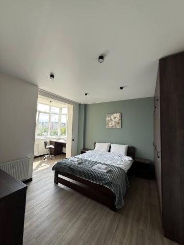 a bedroom with a bed in a room at Апартаменти ВІП вул Під Голоском 15 б 9-2 in Lviv