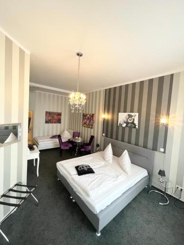 Postel nebo postele na pokoji v ubytování Hotel Maison LeMi