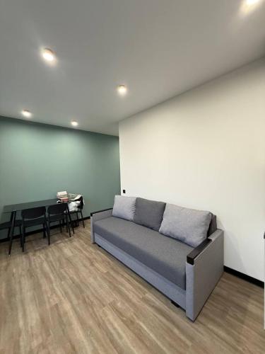 a living room with a couch and a table at Апартаменти ВІП вул Під Голоском 15 б 9-2 in Lviv