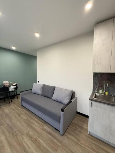 a living room with a couch and a table at Апартаменти ВІП вул Під Голоском 15 б 9-2 in Lviv