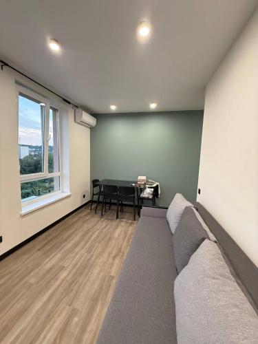 a living room with a couch and a table at Апартаменти ВІП вул Під Голоском 15 б 9-2 in Lviv