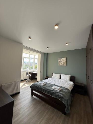 a bedroom with a large bed in a room at Апартаменти ВІП вул Під Голоском 15 б 9-2 in Lviv