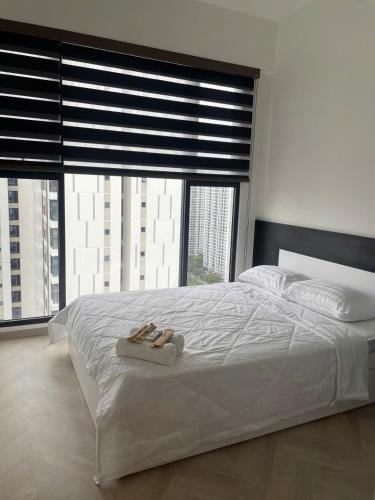 Ένα ή περισσότερα κρεβάτια σε δωμάτιο στο vinhome grand park