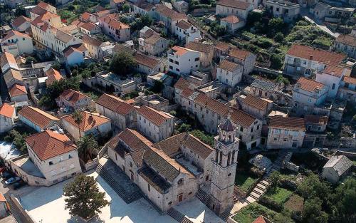 an aerial view of a town with a church at Villa Lav in Prigradica